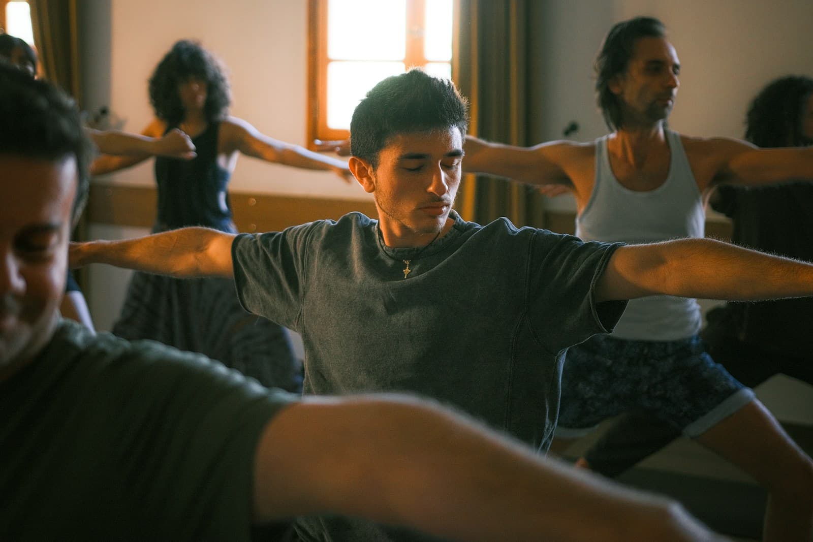 People practicing yoga in a studio — the kind of class slots no-shows empty out